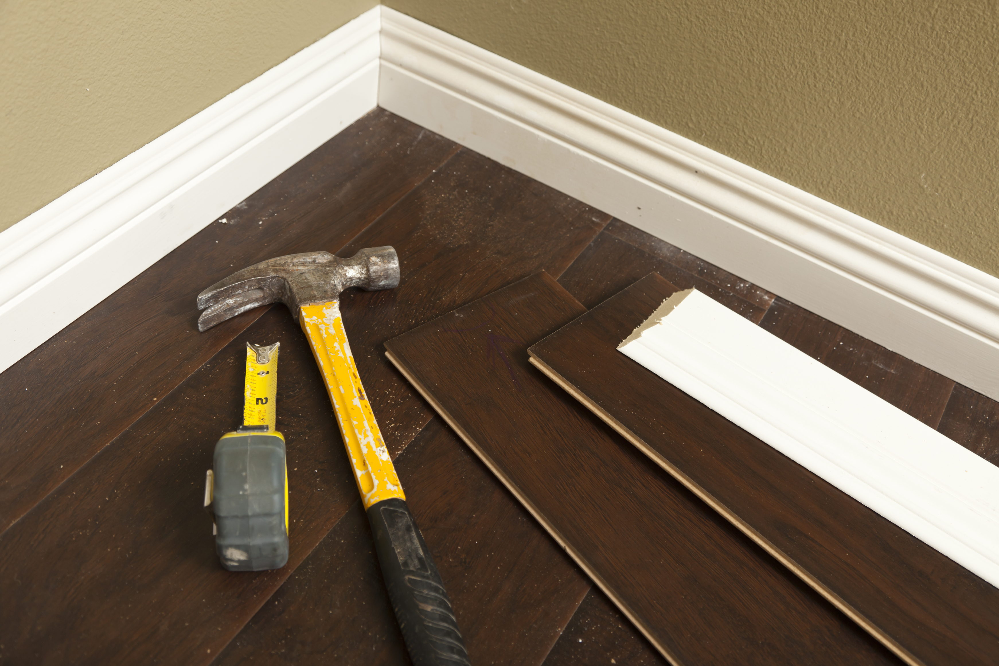 hammer laminate flooring and new baseboard molding Mobile and