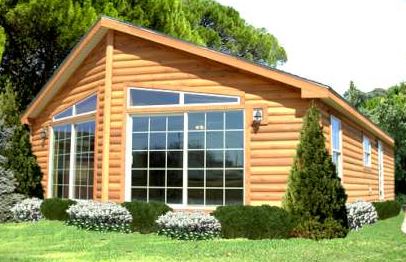 Wood sided manufactured home with picture window on end
