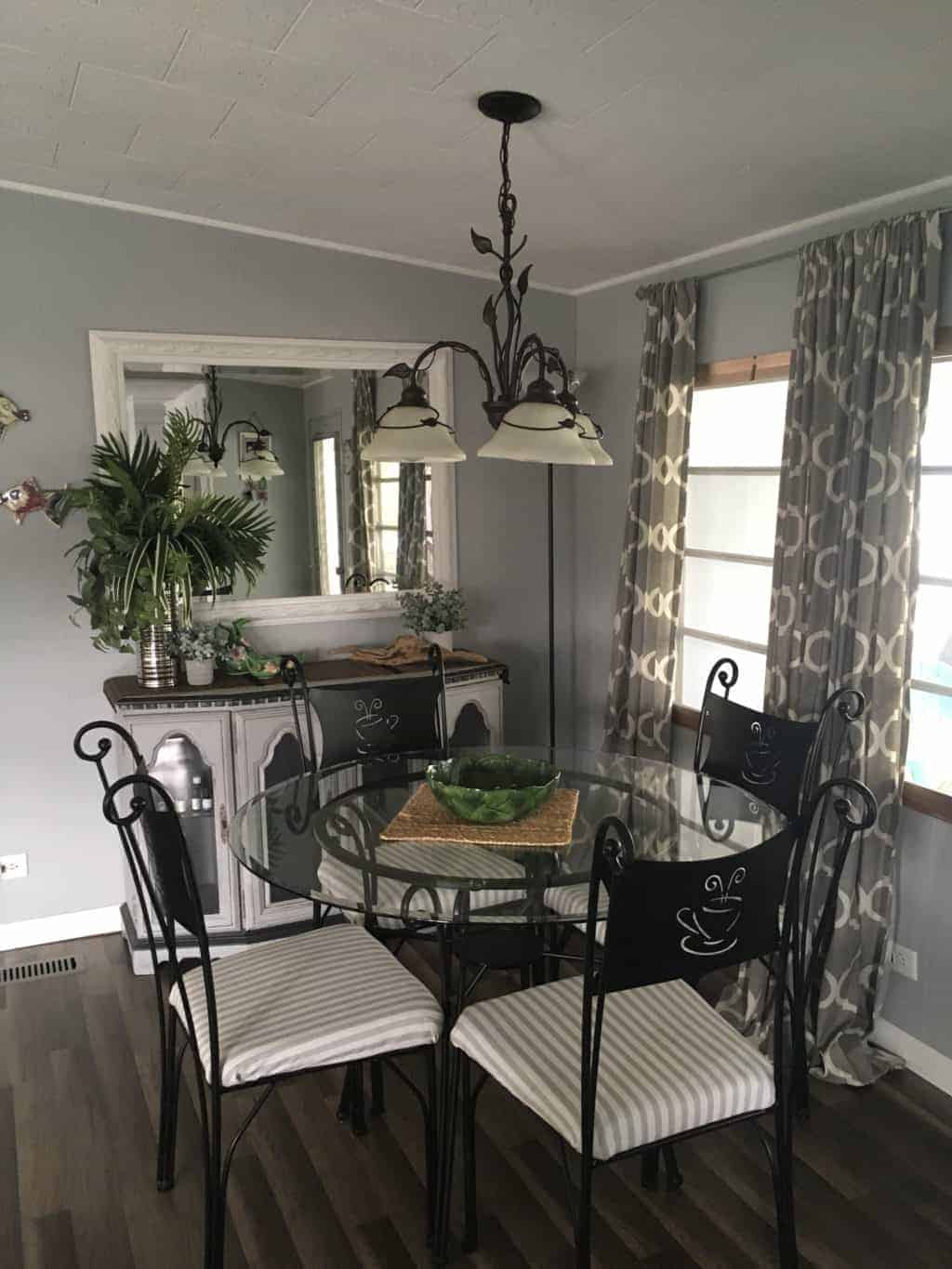 Our Favorite Affordable Decorating Hacks For Mobile Homes 1964 chateau low chandelier over dining room table 1