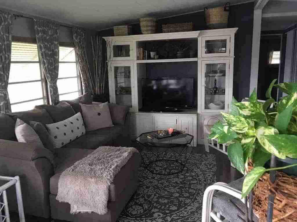 1964 chateau - use curtains and dark paint to give small mobile home living room warmth and style