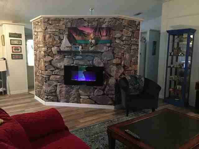 1985 Palm Harbor Single Wide Makeover - stone wall mural and faux fireplace completed