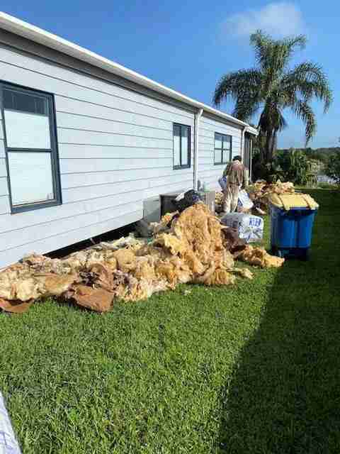 Step Removing Old Insulation Under A Mobile Home