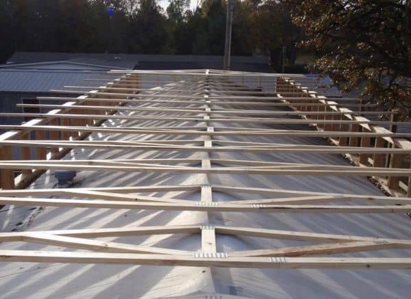 building a self supporting mobile home roof over trusses on roof ready to be installed