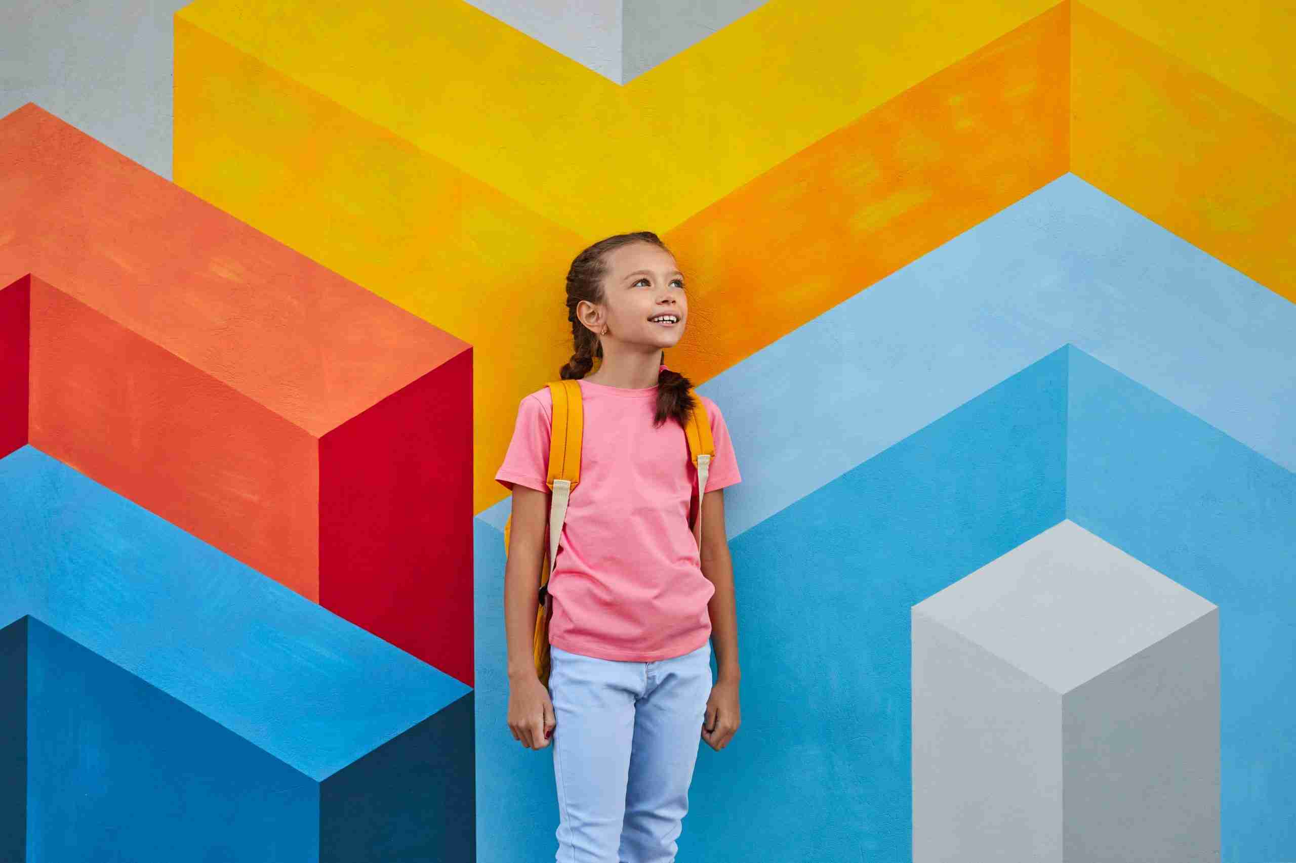 Cheerful schoolgirl against colorful wall 2022 11 23 00 45 11 utc scaled | mobile home living