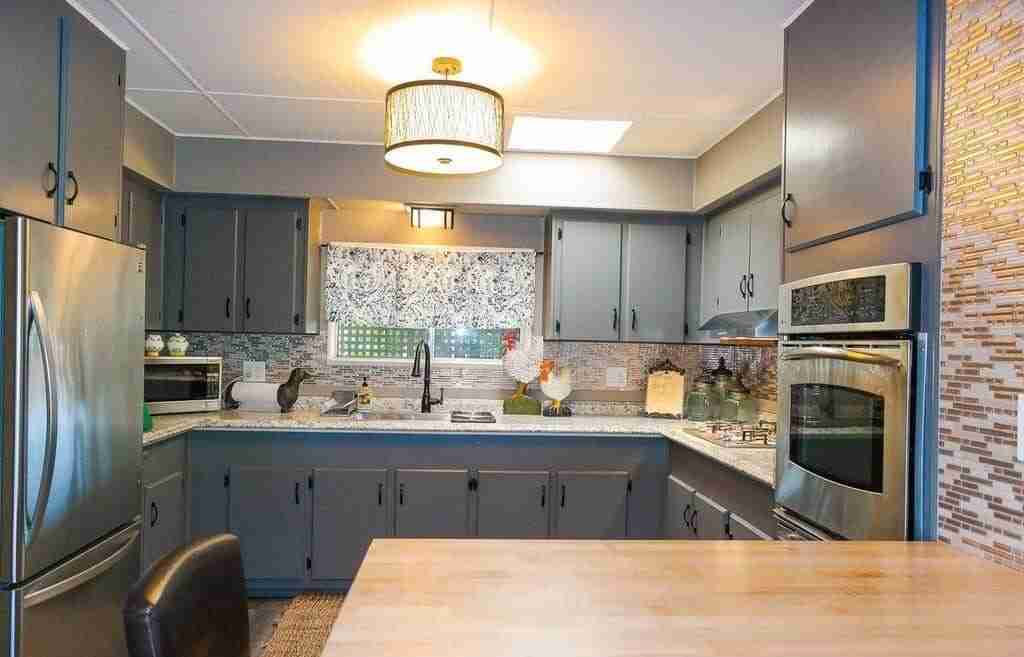 Mobile home renovations jaw-dropping-mobile-home-gray-kitchen-1