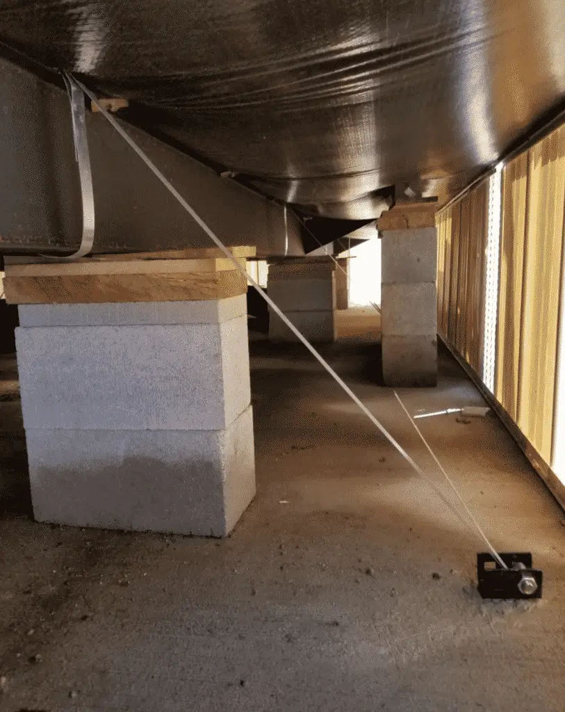 Underbelly And Blocks Under A New Manufactured Home With Tie Downs
