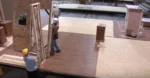 walls being installed over flooring in manufactured home construction factory 2