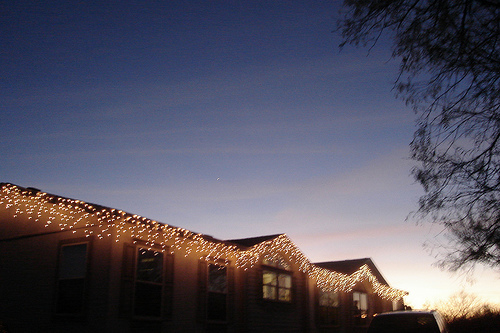 Icicle lights hanging on double wide manufactured home- christmas in a mobile home
