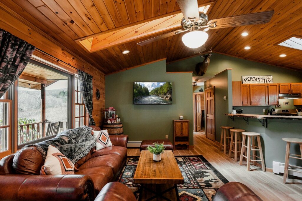 a living room filled with furniture and a flat screen tv