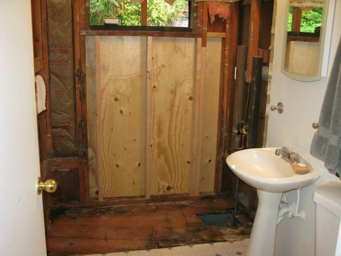 Bathroom 1 - New studs and exterior plywood sheathing installed