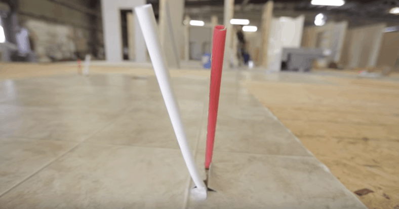 PEX plumbing water lines raising from floor joist up through floor in new manufactured homne construction - Jacobsen Homes