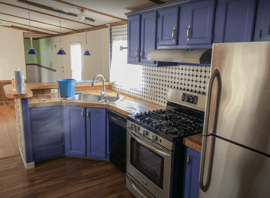 Single Wide Manufactured Home With Blue Kitchen Cabinets