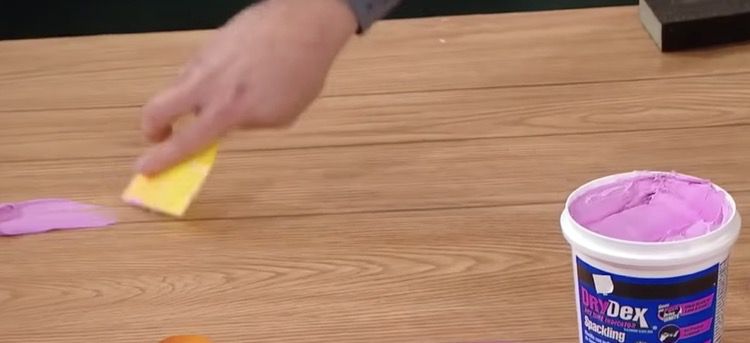 Using drydex to fill in grooves in wood paneling - rachel ray show