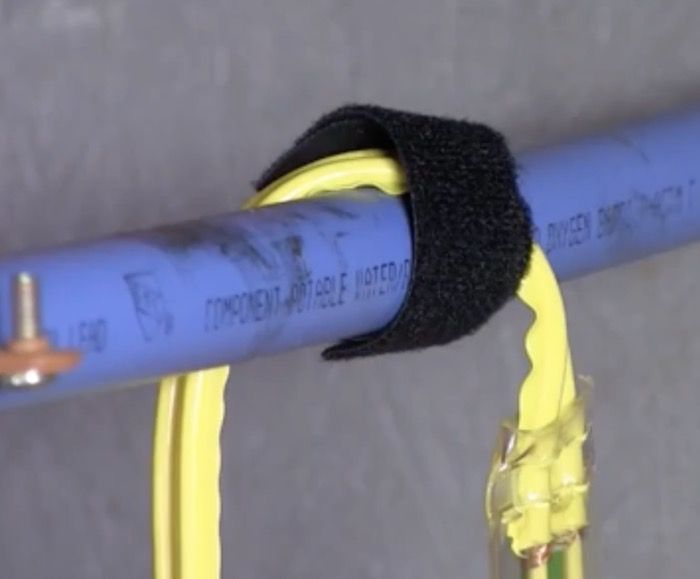 attaching heat tape to the pipe