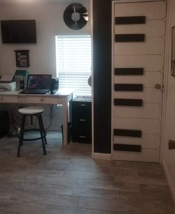 Beach theme mobile home  Office with piano keys on the wall