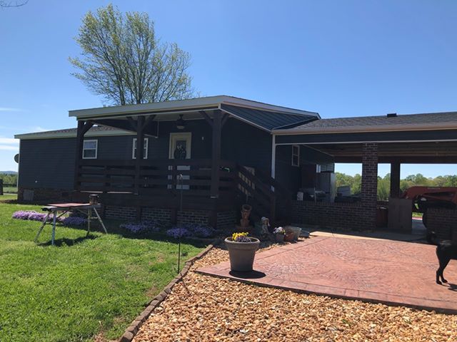 Clayton Double Wide After With Carport