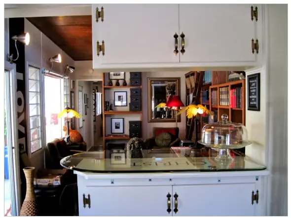 Kitchen and living room after complete remodel of vintage mobile home