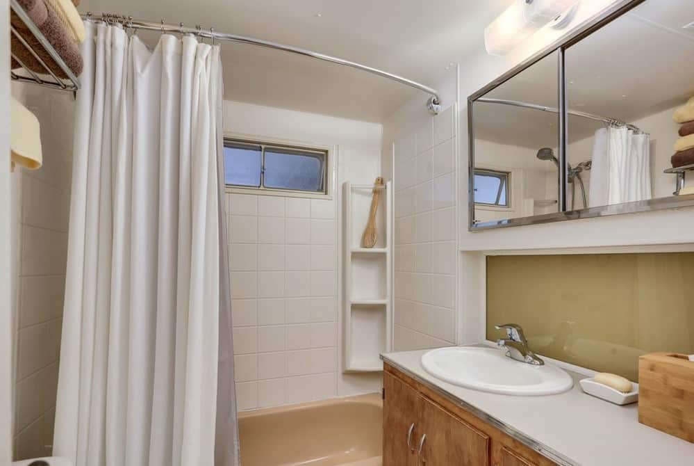 Mid-Century Design Is The Star Of This Unforgettable 1950'S Vintage Trailer Mint green trailer bathroom