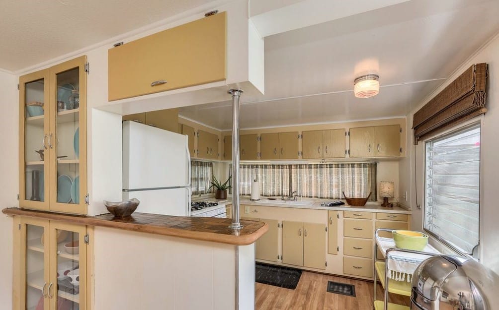 Mid-Century Design Is The Star Of This Unforgettable 1950'S Vintage Trailer Mint green trailer breakfast bar