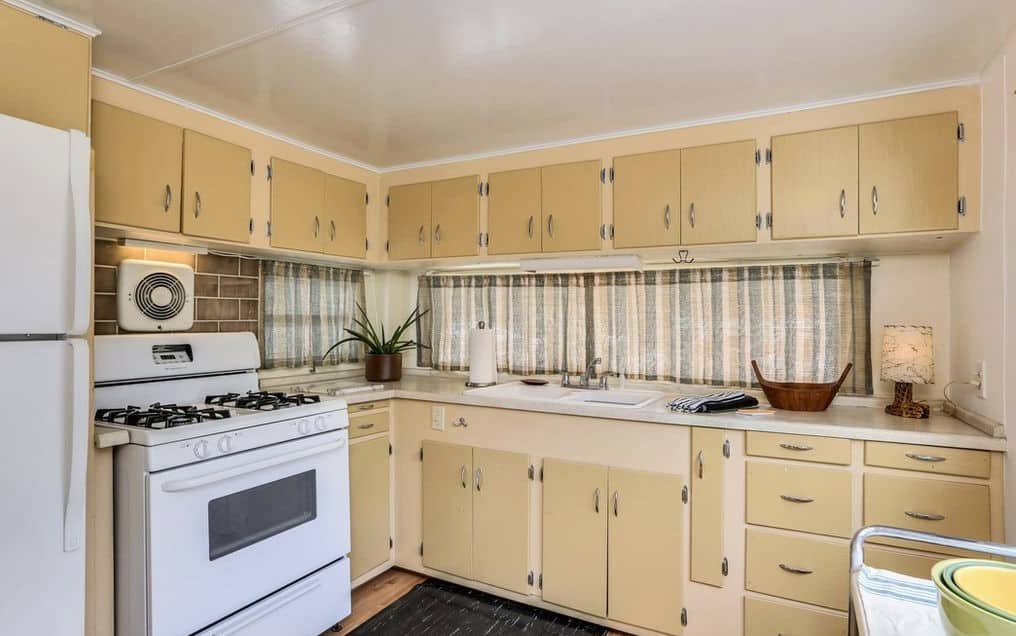 Mid-Century Design Is The Star Of This Unforgettable 1950'S Vintage Trailer Mint green trailer kitchen