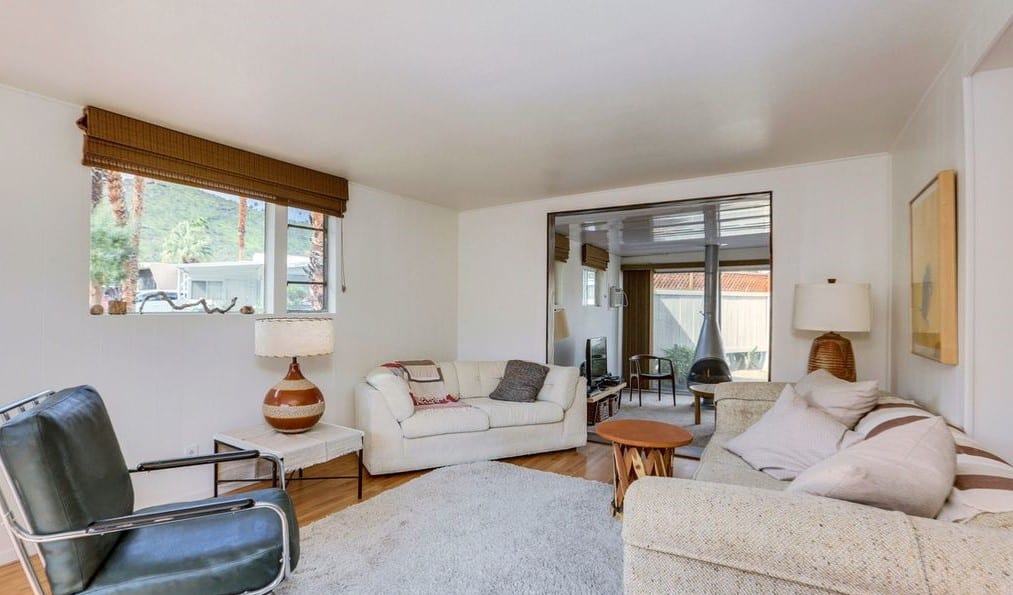 Mid-Century Design Is The Star Of This Unforgettable 1950'S Vintage Trailer Mint green trailer living room view