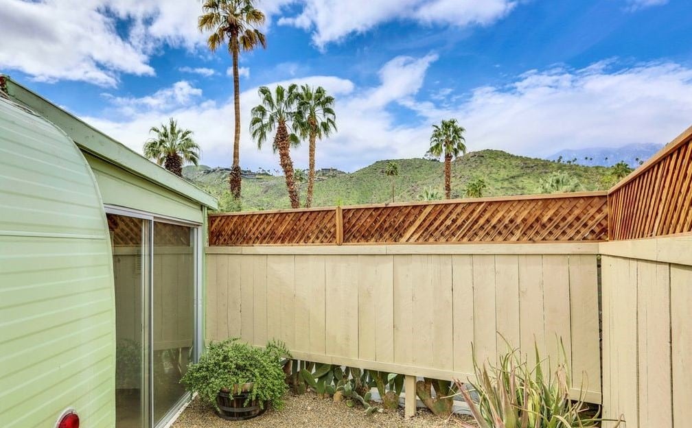 Mid-Century Design Is The Star Of This Unforgettable 1950'S Vintage Trailer Mint green trailer yard view