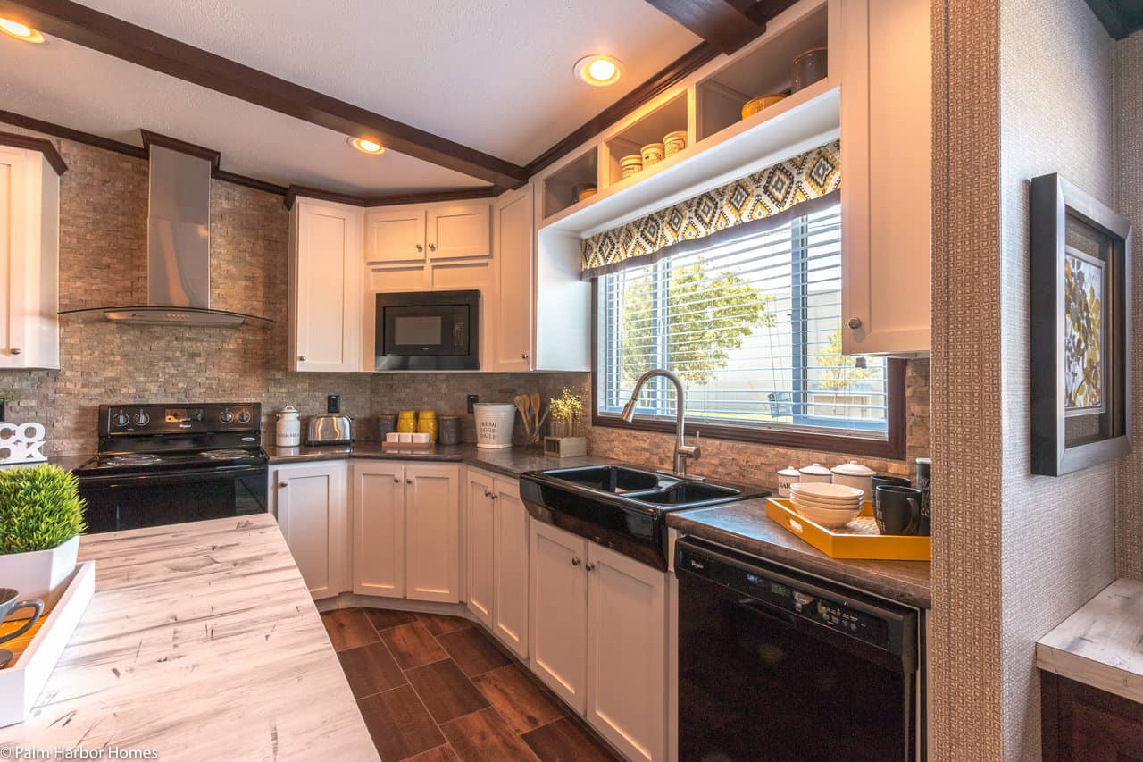 mobile home kitchens featuring black appliances