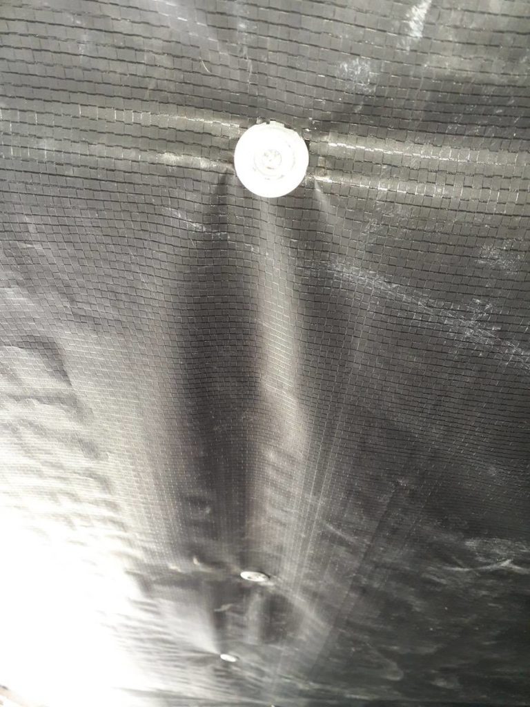 Nail And Washer Used To Fasten New Belly Board To Mobile Home