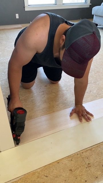 nailing down planks on subfloor of manufactured home for affordable DIY farmhouse flooring