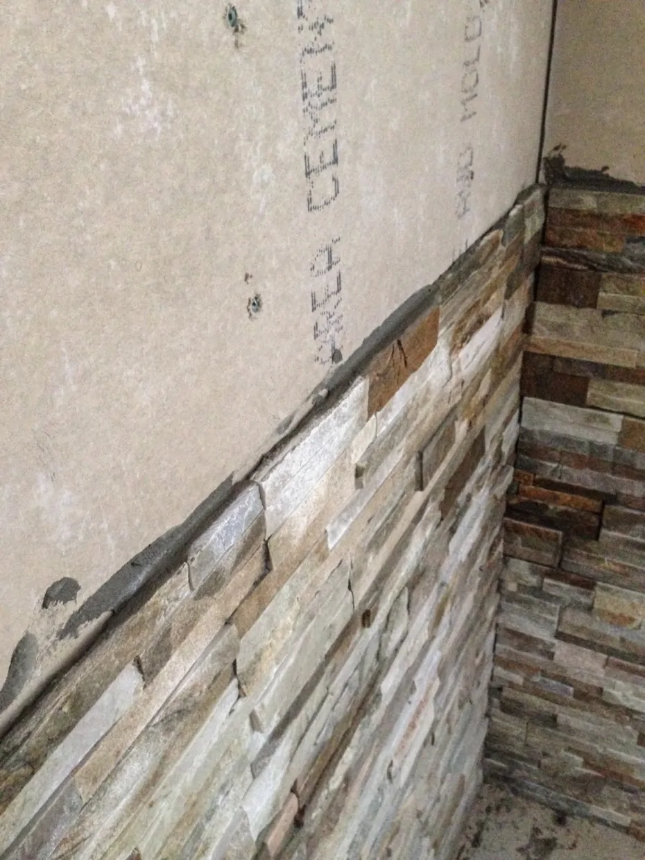 stone tile behind wood stove installation