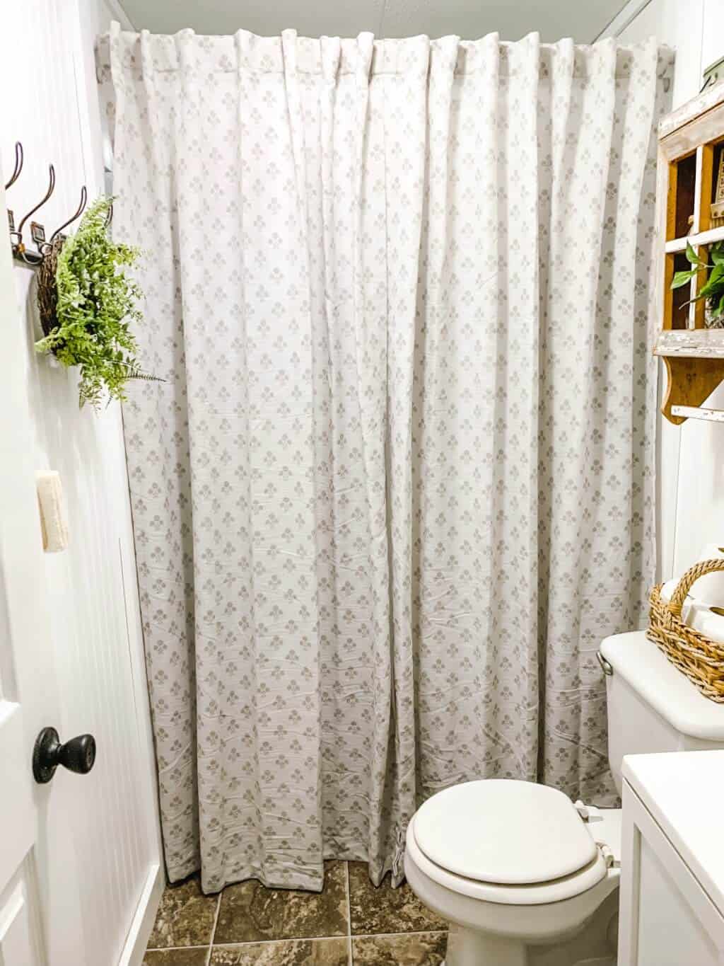 Tall shower curtain adds height for low ceilings - affordable farmhouse bathroom makeover